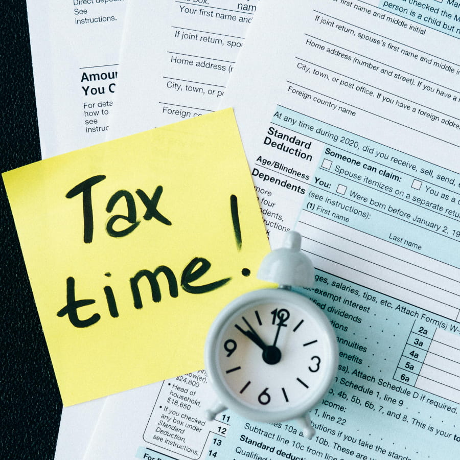 Clock showing it is past tax time